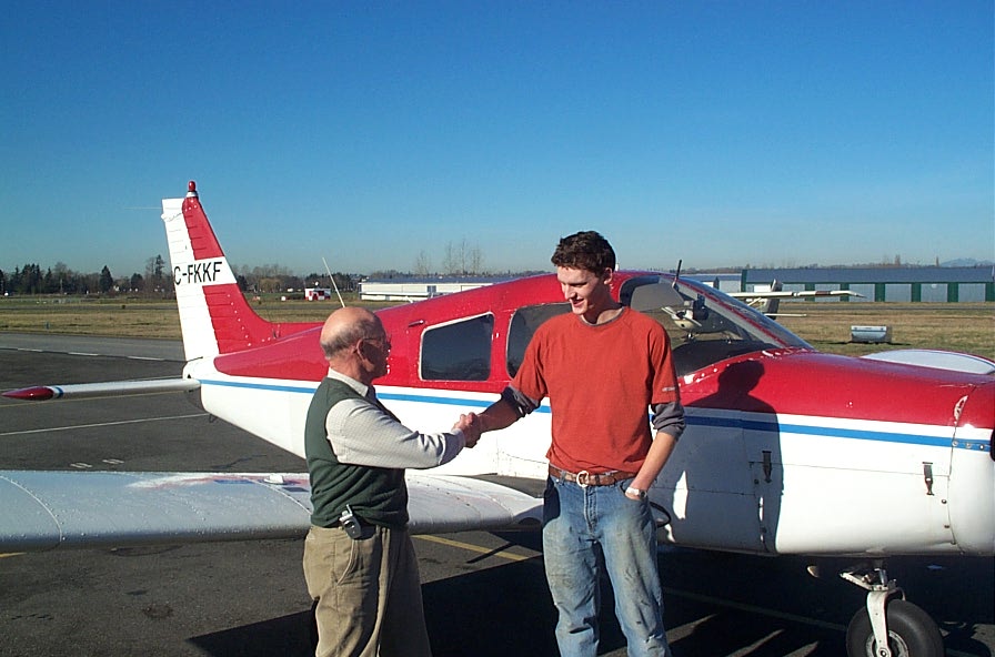 Chad Drake with Pilot Examiner Donn Richardson after the successful completion of Chad's Private Pilot Flight Test.  Langley Flying School.