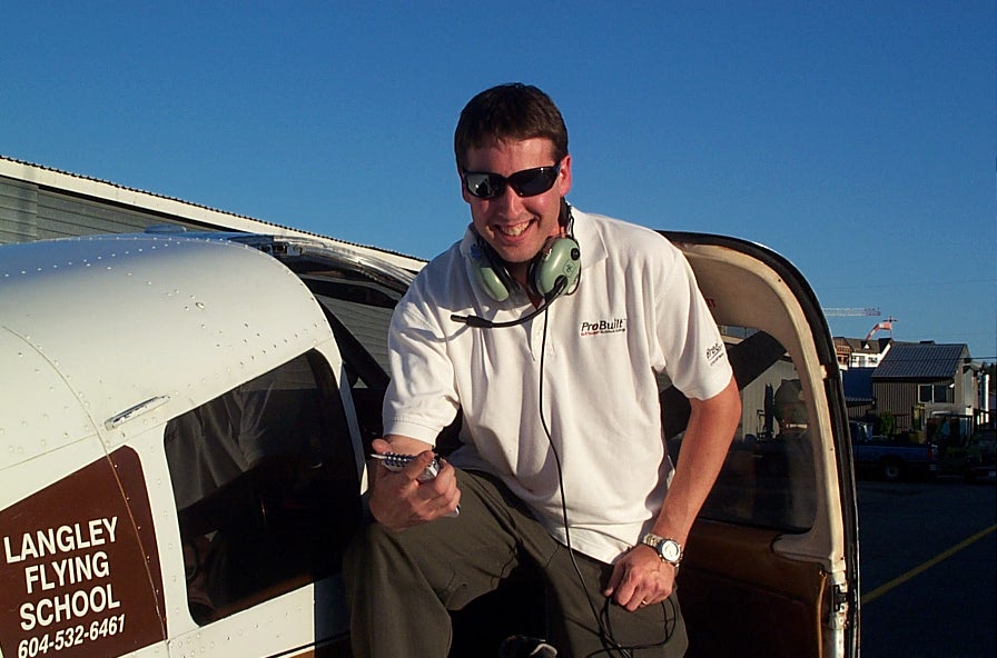 Dean Bicknell on the wing of Cherokee GUKG after completing his First Solo Flight on September 24, 2009.  Langley Flying School.