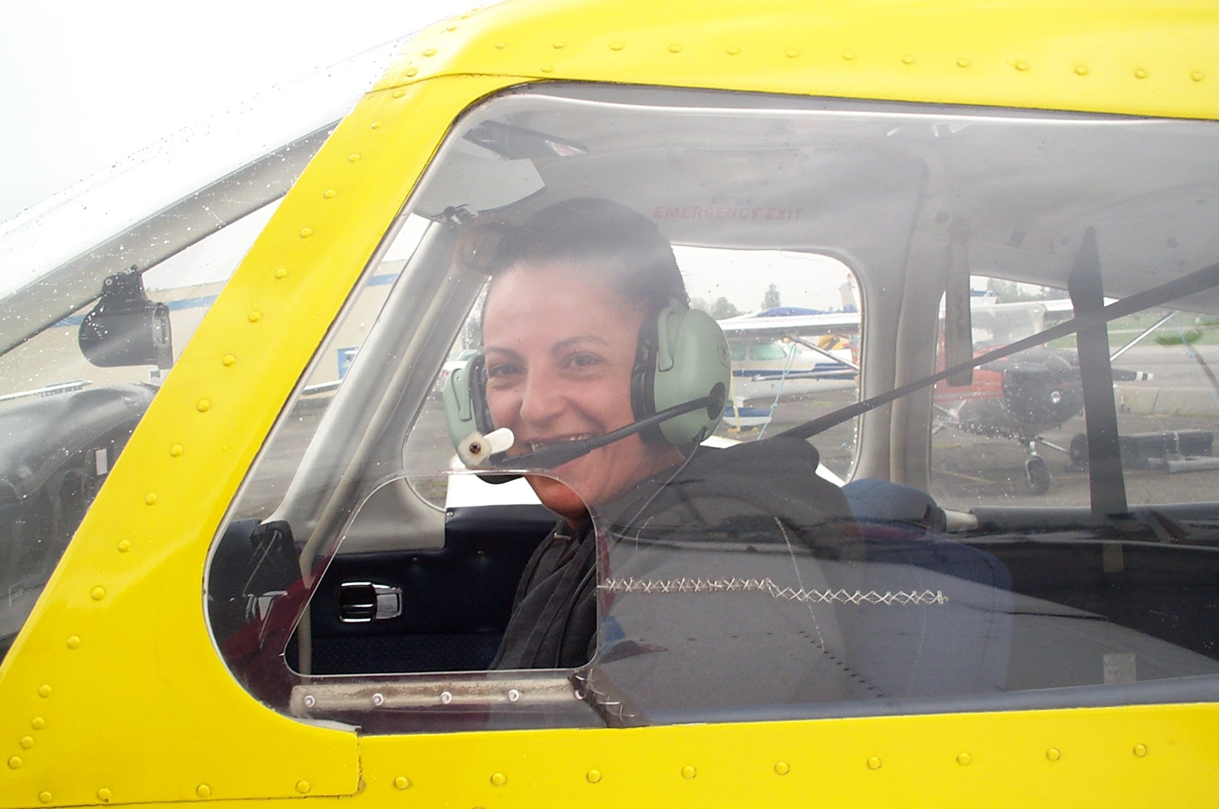 May Bogle in the cockpit of Cherokee GODP after completing her First Solo Flight on April 23, 2010.  Langley Flying School.