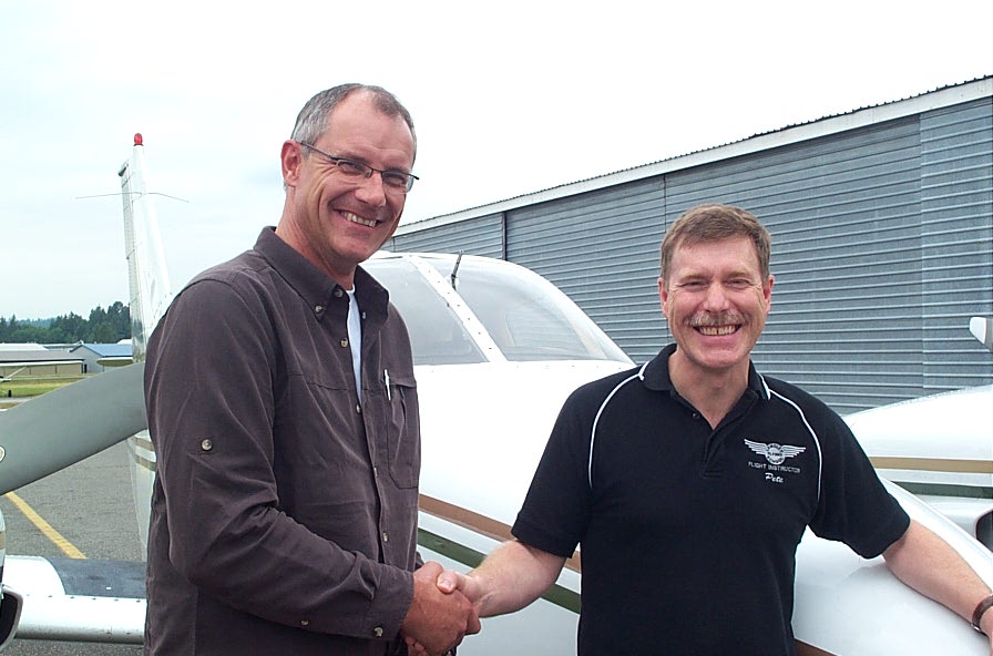 Peter Waddington receives congratulations from Pilot Examiner Matt Edwards after the succesful completion of Peter's flight test for the Group 1 (Multi-engine) Instrument Rating on June 26, 2008.  Langley Flying School.