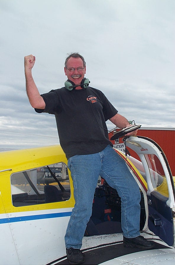 Peter McCreath on the wing of Cherokee GODP after completing his First Solo Flight on October 9, 2007.  Langley Flying School.