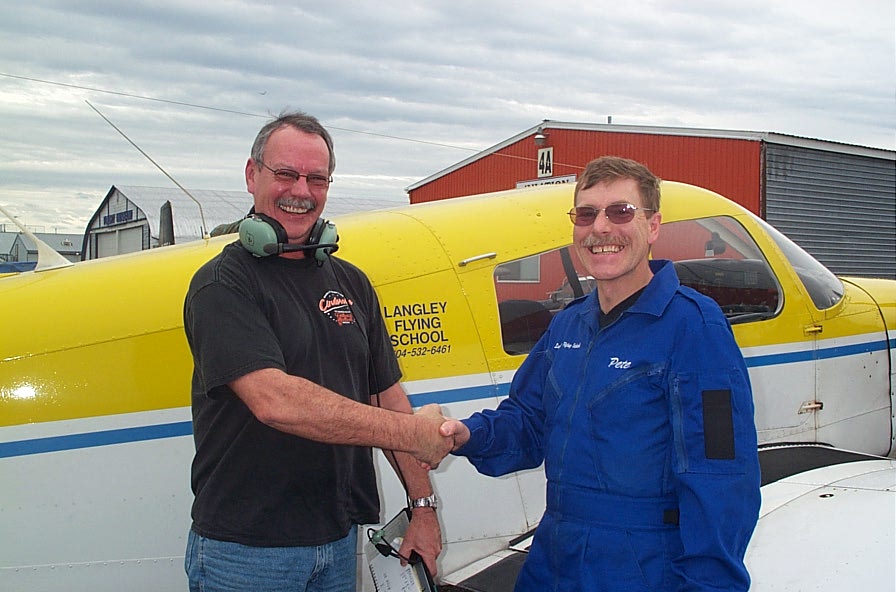 Peter McCreath with Flight Instructor Peter Waddington after the completion of Peter's First Solo Flight on October 9, 2007.  Langley Flying School.