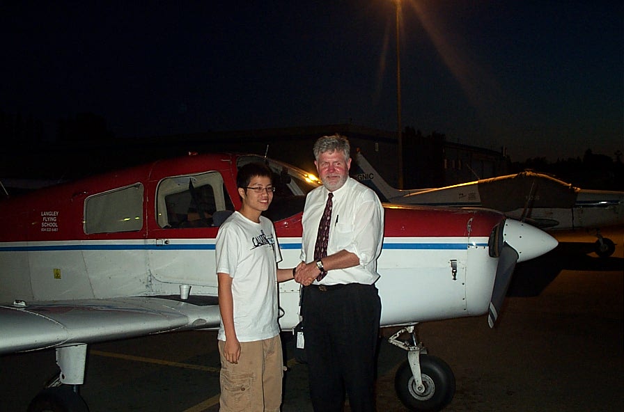 Yu-Hung (Terry) Chou with Pilot Examiner Paul Harris after the successful completion of Terry's Private Pilot Flight Test on August 12, 2008.  Langley Flying School.