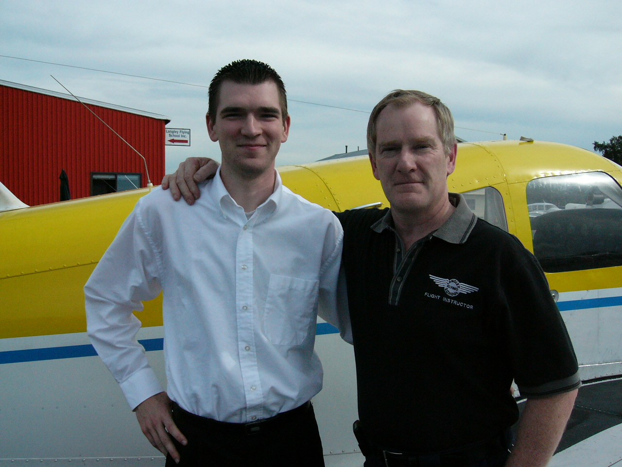 Sean Larkin with his Dad and Flight Instructor, Tom Larkin, following the successful completion of Sean Commercial Pilot qualifying Flight Test June of 2004.  Tom was Sean's recommending Flight Instructor.  Langley Flying School.