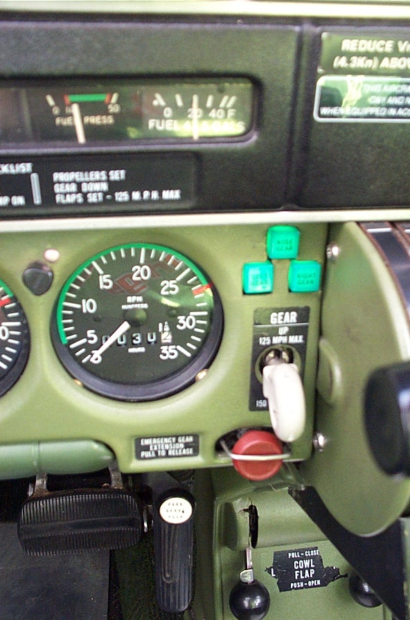 Seneca GURW's landing gear lever and lights, as well as emergency gear extension knob (red).  Langley Flying School.
