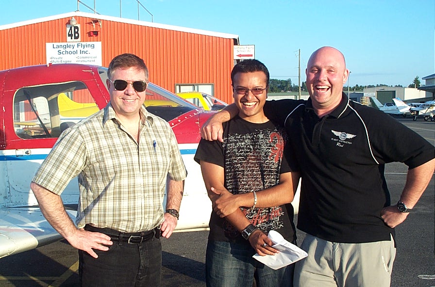 Aaron Pinto with Flight Instructor Rod Giesbrecht and Pilot Examiner Jim Scott after the successful completion of Aaron's Private Pilot Flight Test on July 22, 2008.  Langley Flying School.