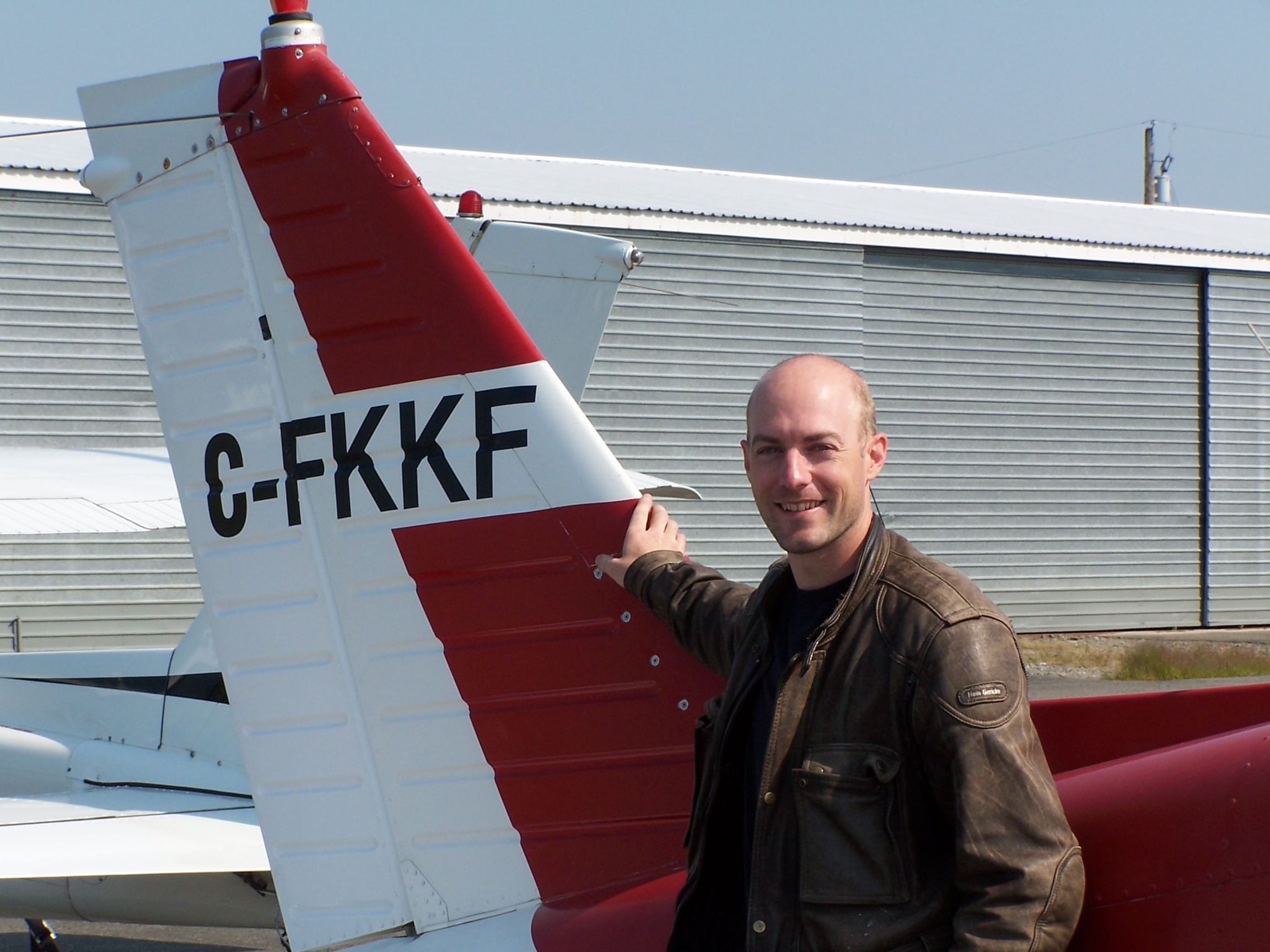 Adam Helfer, shortly after completing his Private Pilot Flight Test on August 30, 2009 with Pilot Examiner Paul Harris.  Congrats also to Adam's Flight Instructor, Hoowan Nam.  Langley Flying School.