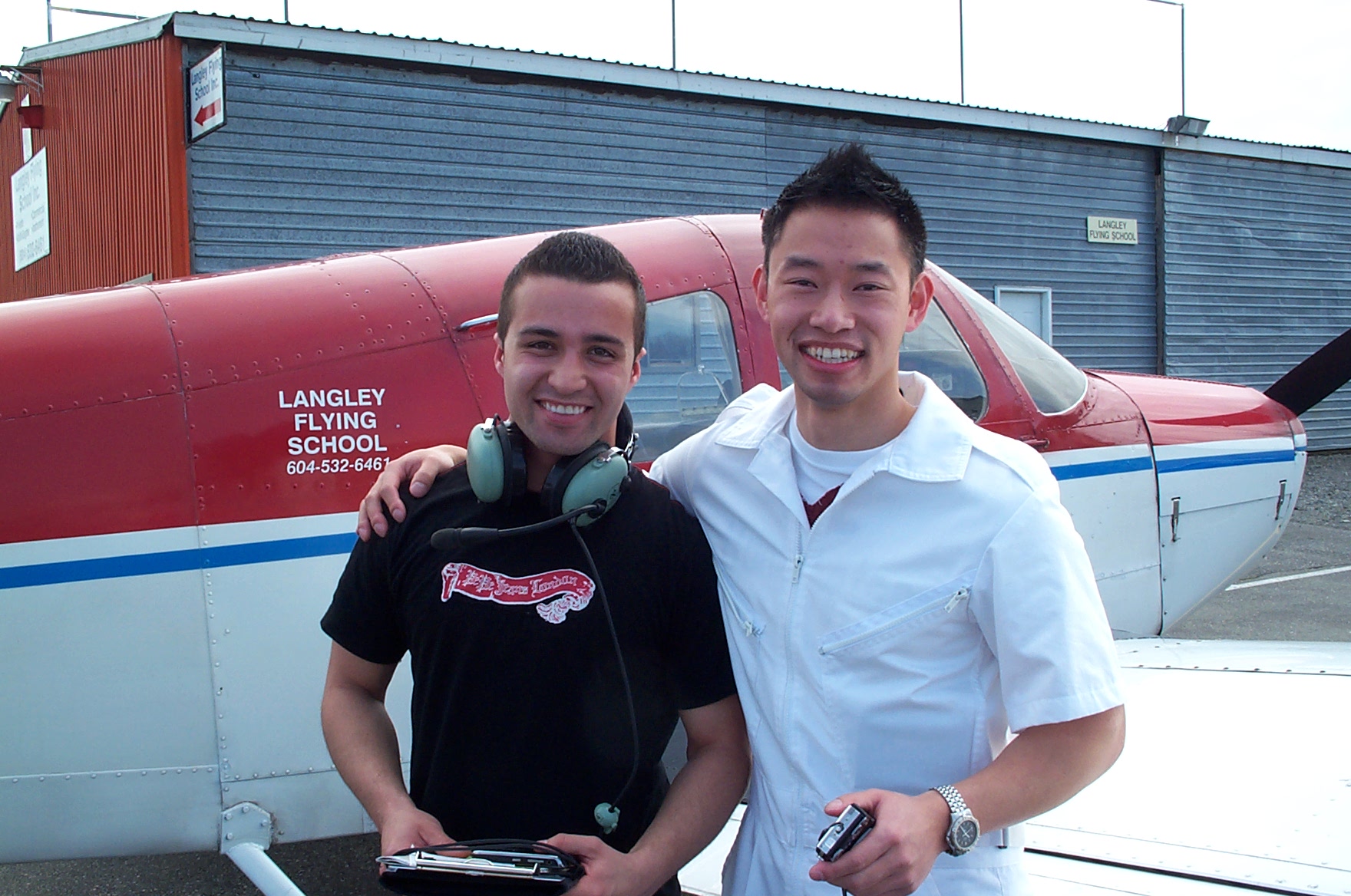 Andres Angulo with his Flight Instructor Nam Vu after completing his First Solo Flight on April 14, 2010.  Langley Flying School.