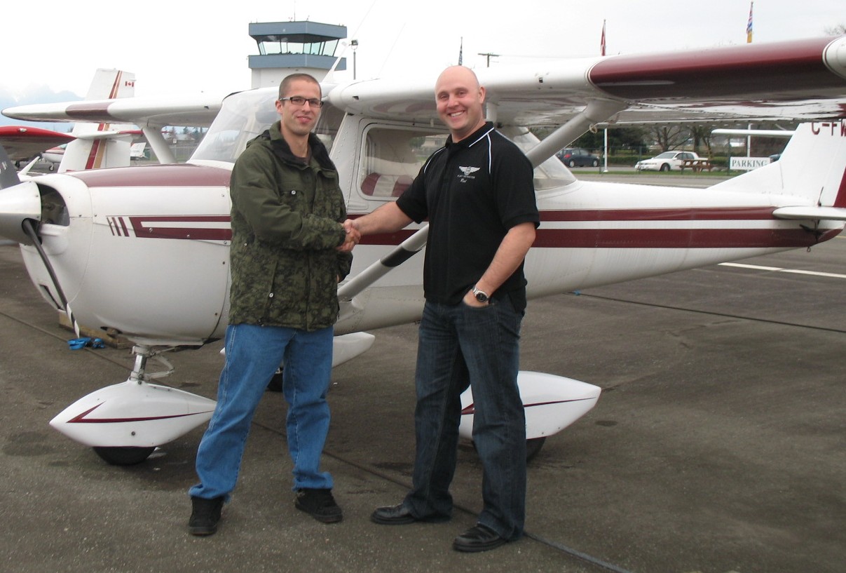 Andrew Otterstrom with Flight Instructor Rod Giesbrecht after the succesful completion of Andrew's Commercial Pilot Flight Test.  Langley Flying School.