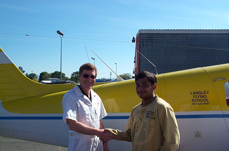  Aniket Chavan with Flight Instructor Peter Waddington after completing his First Solo Flight on May 29, 2007.  Langley Flying School