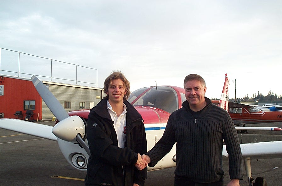 Darren Kroeker with Pilot Examiner Jim Scott after the successful completion of his Private Pilot Flight Test on January 23, 2010.  Langley Flying School.