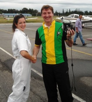 David Whiteley receives congratulations from Flight Instructor Naomi Jones after the completion of David's First Solo Flight on September 6, 2009.  Langley Flying School.