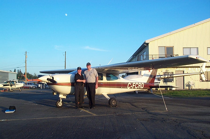 David Day receives congratulations from Pilot Examiner John Laing after the successful completion of David's Private Pilot Flight Test on May 16, 2008.  Langley Flying School.