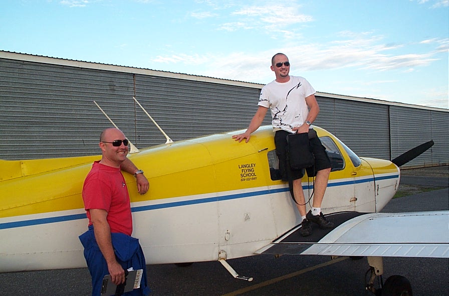 Matt Roesma on the wing of Cherokee GODP after the completion of his First Solo Flight on August 23, 2008.  Matt's Flight Instructor, Rod Giesbrecht, appears to the left.  Langley Flying School.