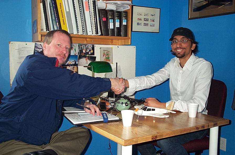 Mayank Mittal receives congratulations from Transport Canada Inspector Peter Cox after the successful completion of Mayank's Flight Instructor Rating on November 4, 2009.  Langley Flying School.