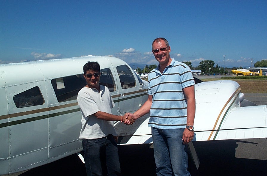 Raman Srivastava with Pilot Examiner Matt Edwards after the successful completion of Raman's Flight Test for the Multi-engine Class Rating on July 9, 2008.  Langley Flying School.