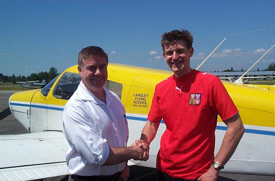Richard Haisinger with Pilot Examiner Jim Scott after the successful completion of Richard's Private Pilot Flight Test.  Langley Flying School.
