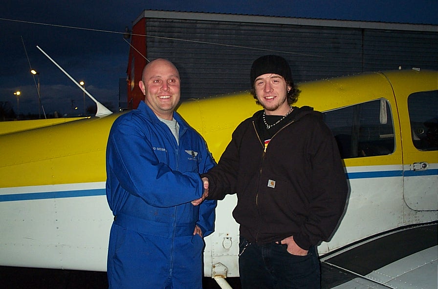 Steve Dikes with Flight Instructor Rod Giesbrecht after the completion of Steve's First Solo Flight on February 10, 2008.  Langley Flying School.