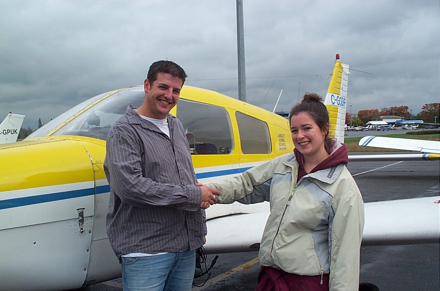 Tony McHale with Flight Instructor Naomi Jones, after completing his First Solo Flight on October 1, 2007.  Langley Flying School.