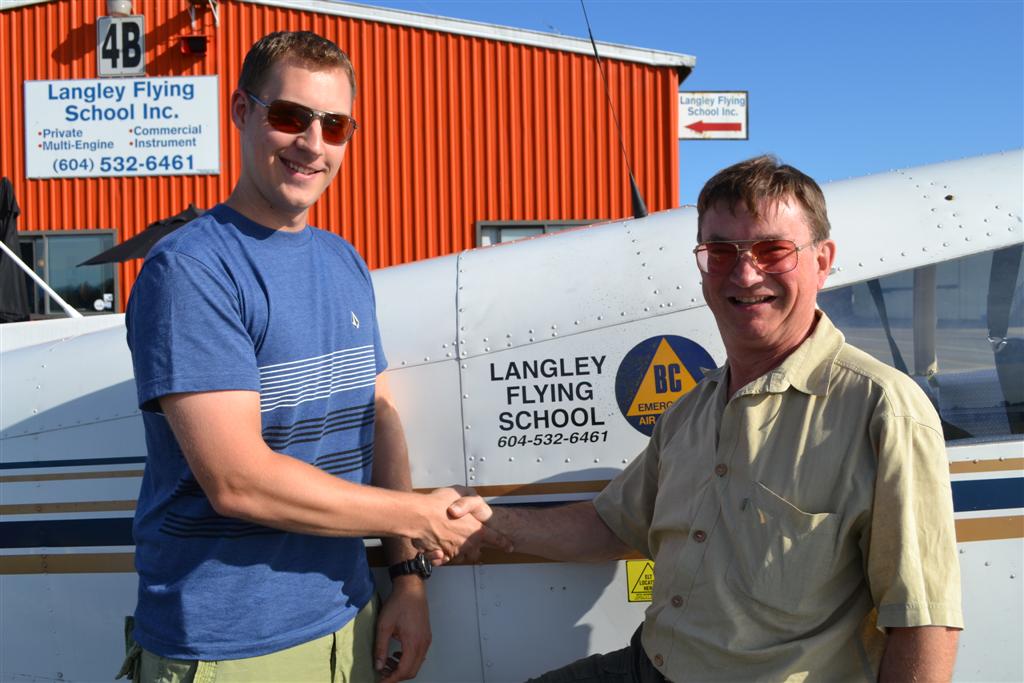 Trevor Conkey receives contgratulations from his Pilot Examiner John Laing, after the successful completion of Trevor's Private Pilot Flight Test on August 1, 2011. Langley Flying School