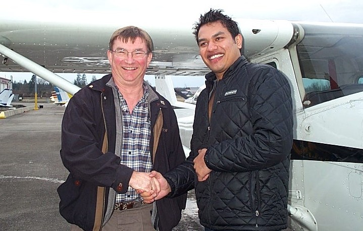 Vikas Chouidhary with Pilot Examiner John Laing after the successful completion of Vikas' Private Pilot Flight Test.  Langley Flying School.