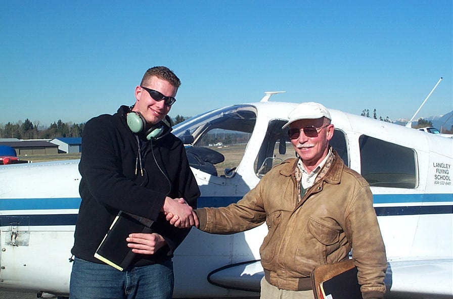 Warren Darby with Pilot Examiner Donn Richardson after the successful completion of Warren's Private Pilot Flight Test.  Langley Flying School
